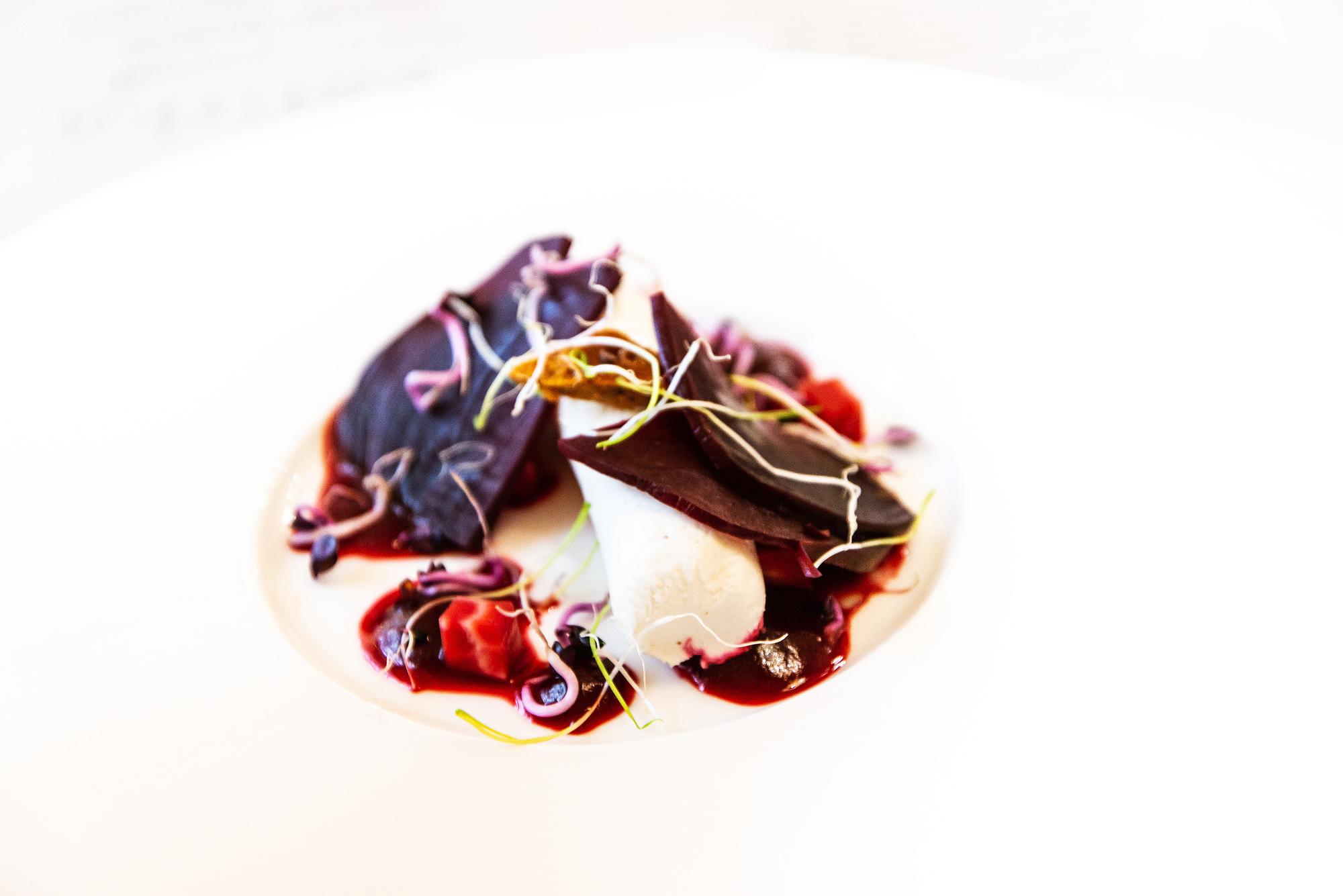 Close-up of plated course with seasonal garnish
