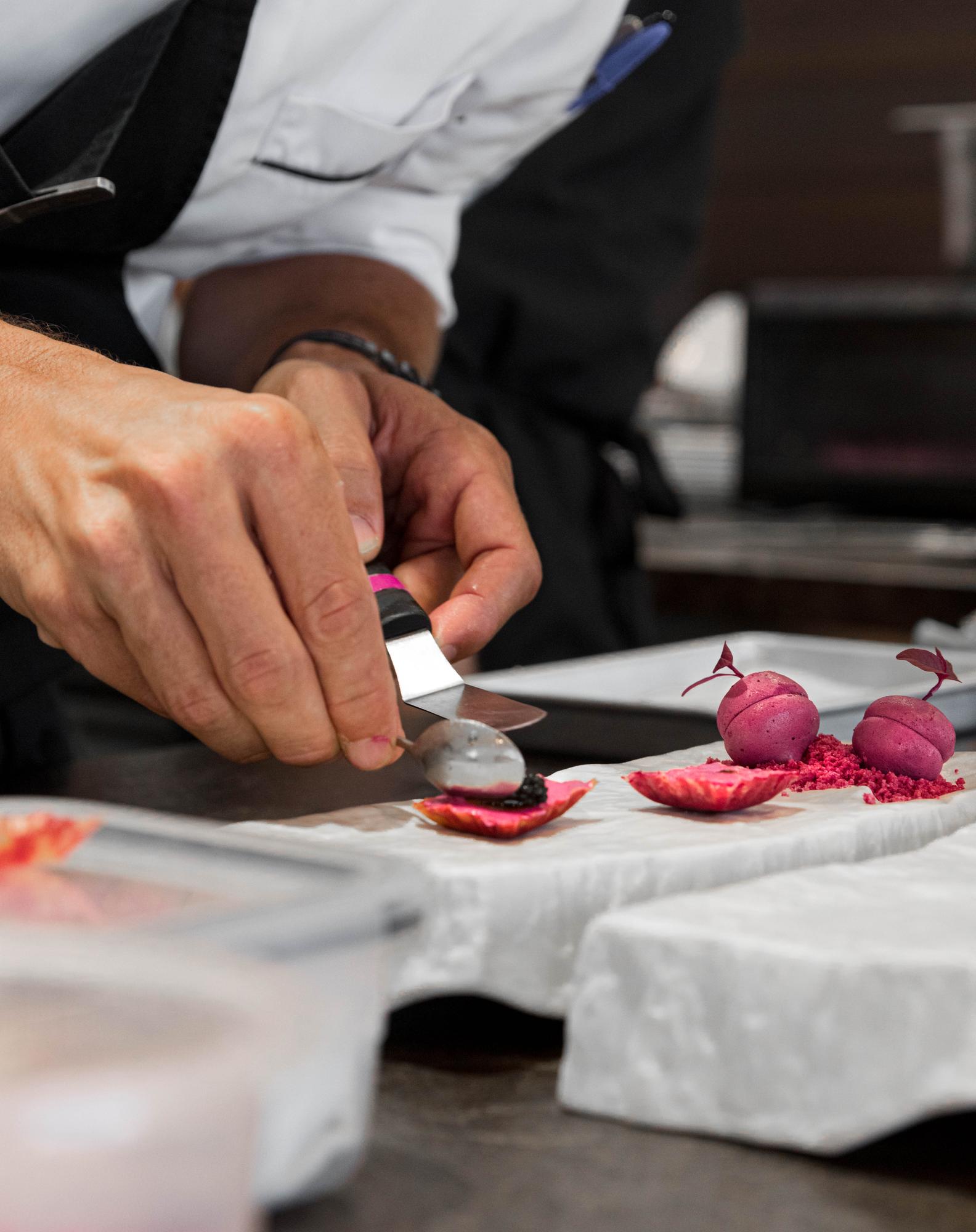 Assistant instructor demonstrating knife skills